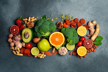 Healthy food clean eating selection. Assortment of fresh organic vegetables, fruits, nuts and dried fruits. Healthy diet for lungs.