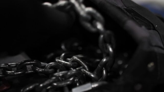 Metal chains inside open stage equipment bag
