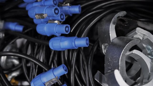 Pile of stage power cables with blue connectors