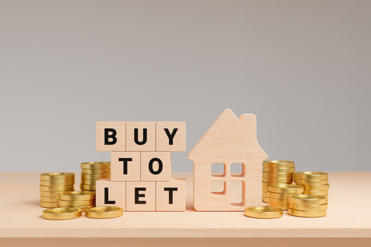 BUY TO LET text on wooden cube with house and gold coins on table, leasing business and rental market of residential houses concept, 3d render
