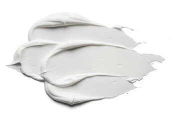 Close-up of white cream smear on a white background for beauty or skincare