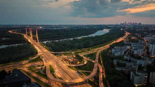 Evening timelapse over Warsaw skyline with lights on Siekierkowski bridge