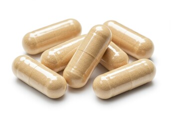 Pile of beige capsules on a white background for medical use