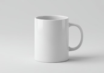Fototapeta premium Simple white ceramic mug with handle on a plain surface, ideal for customization or branding projects