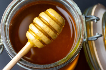 jar of honey and dipper