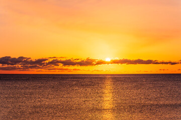 scenic view at beautiful morning beach coastline with orange sand, blue sea water of gulf and beautiful cloudy sky. Nature landscape of wallpaper and backgeound