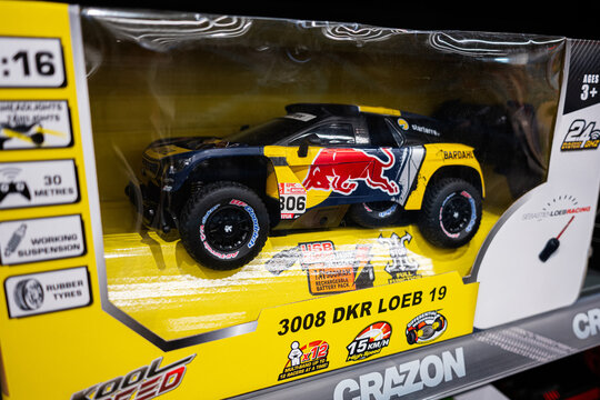 Toy remote Red Bull 3008 DKR Loeb 19 control vehicle in packaging displayed on store shelf