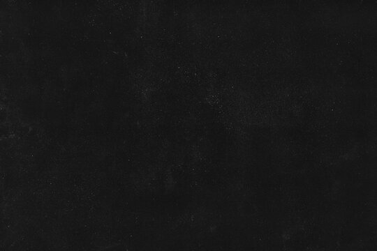 Distressed texture, retro dust and scratches overlay; grunge background for creating analogue film effect; worn-out, dusty dark scan of black paper