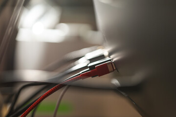 The USB hard disk is plugged into the back of the computer monitor.