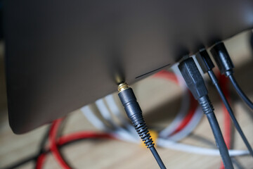 The USB hard disk cable is plugged into the back of the computer monitor.