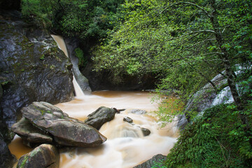 flowing water in a creek over the mountains in tuscany