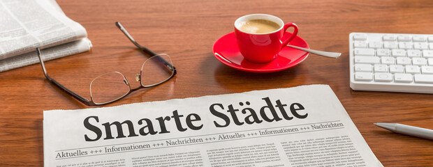 Zeitung auf Schreibtisch - Smarte Städte