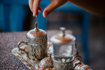 Traditional Turkish Copper Coffee Cup on Ancient Stone, Lid Opening