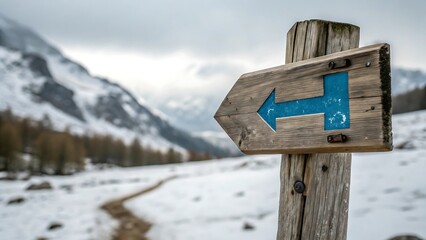 Naklejka premium Wooden Hiking Trail Signpost Arrow Winter Mountains Snowy Path