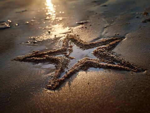 Golden star drawing in wet beach sand at sunset. - Powered by Adobe