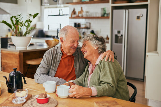 Loving senior couple embracing while looking at each other