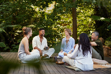Group of holistic people talking to each in relax