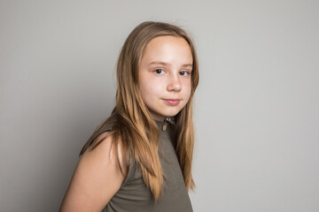 Fototapeta premium Pretty smiling little girl child. Happy and beauty kid on white background, child 6 years old