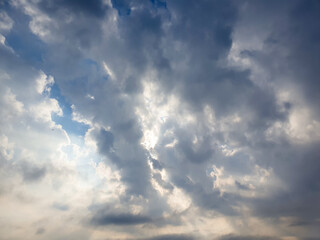 Blue sky with clouds and sunshine. Sky landscape on the horizon with clouds.