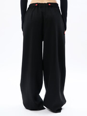 girl model in stylish clothes on a white background in the studio, fashion shooting.