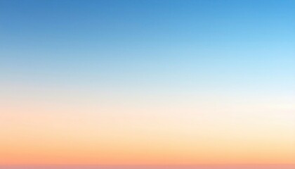 Obraz premium A serene gradient sky transitions from blue to soft orange, creating a peaceful atmosphere perfect for relaxation and inspiration