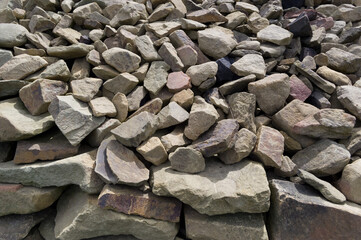 Close-up view of a pile of stones. Material suitable for use in construction. Background for...