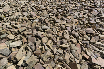 Close-up view of a pile of stones. Material suitable for use in construction. Background for...