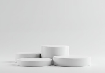Four white cylinder podiums arranged in a staggered display against a clean, bright white background for product presentation