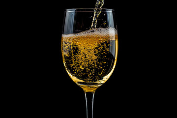 Elegant champagne pouring into glass against dark background