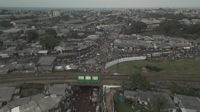 Aerial Drone View of Busy Ndokoti Intersection in Douala During Afternoon Rush