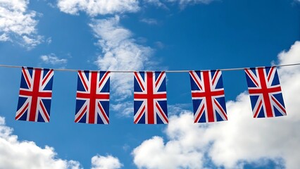 Union jack bunting flags against blue sky