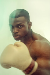 Determined boxer throwing punch with focus and intensity