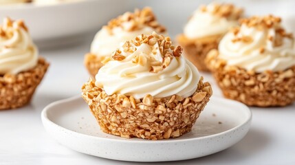 Sweet canaps with piped cream and crushed nuts topping