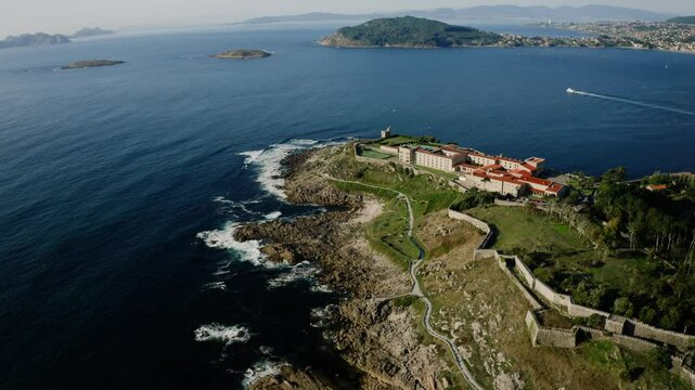 Panoramic Aerial View Of Hotel On Top Of Coastal Hill Overlooking The Ocean and Baiona City In Spain