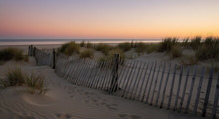 Beach Sand Dunes with Fence at Sunset Serene Coastal Scene