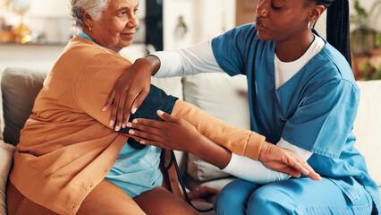 Nurse, senior woman and blood pressure test on sofa with healthcare assessment for hypertension in...