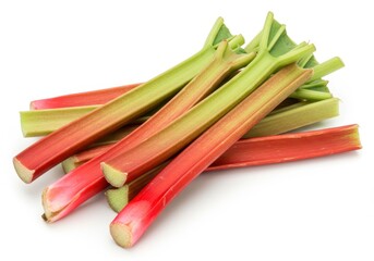 Pile of fresh rhubarb stalks with green leaves and red stems on a white background, ready for cooking