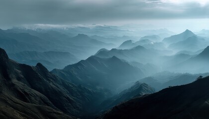 Fototapeta premium The mountain range stretches endlessly, covered in mist