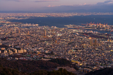 Cityscape of greater Kobe and Osaka area city view from the top of Maya-san in Kobe at twilight time