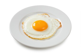 Sunny side up egg on a white plate with a bright yellow yolk against a white background