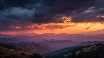 Fototapeta premium A mountain sunset paints the sky with warm colors