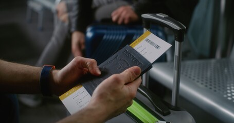 International Airport Terminal: Close Up of Passenger with Luggage Sitting in Departure Lounge of...