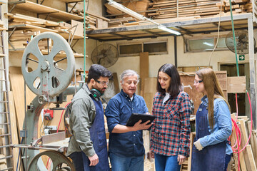 Team collaboration in a busy lumberyard workshop