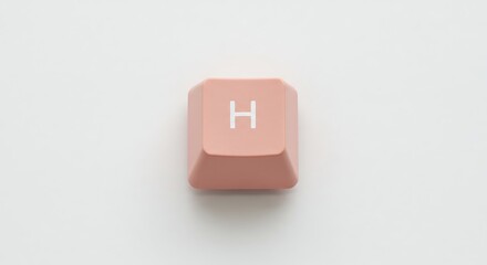 Isolated pink 'H' keycap on white background