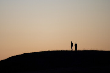 Hikers Embracing Nature in Majestic Mountain Landscape