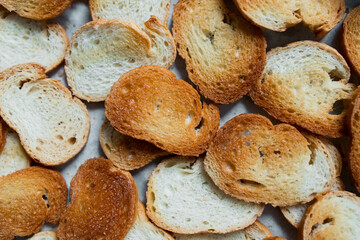 Close up of golden crispy sliced toasted bread background