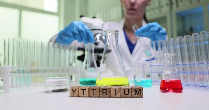 An experienced scientist is conducting an experiment with yttrium in different solutions in a lab setting