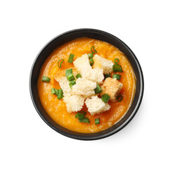 Tasty pumpkin cream soup with croutons and green onion in bowl isolated on white, top view