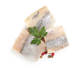 Pieces of delicious herring with parsley and peppercorns isolated on white, top view