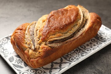Delicious banana bread on grey table, closeup